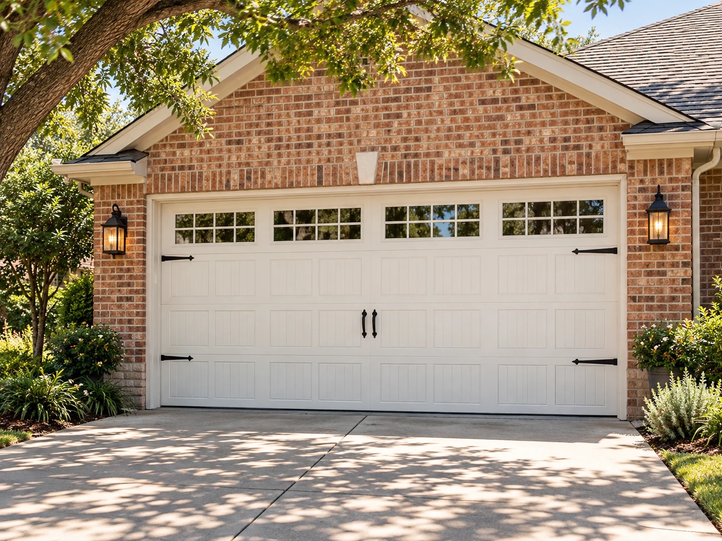 Illustrative painted carriage-style garage door framed by warm brick and light trim
